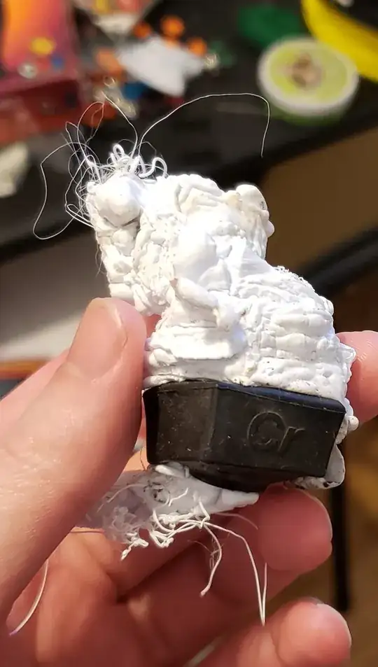 Photo of a large mass of filament sticking out of a silicone sock