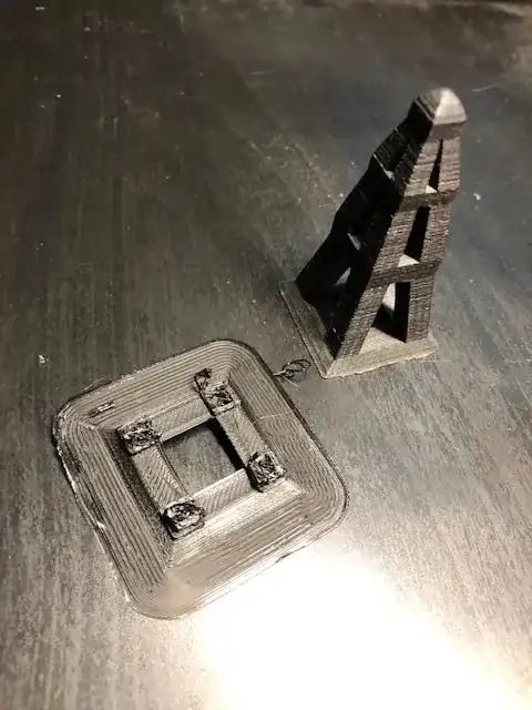 Photo of a stopped print with printing errors and the same model printed properly