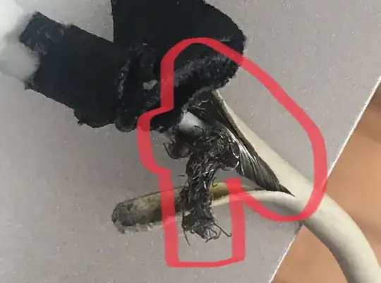 Damaged MagSafe adapter closeup