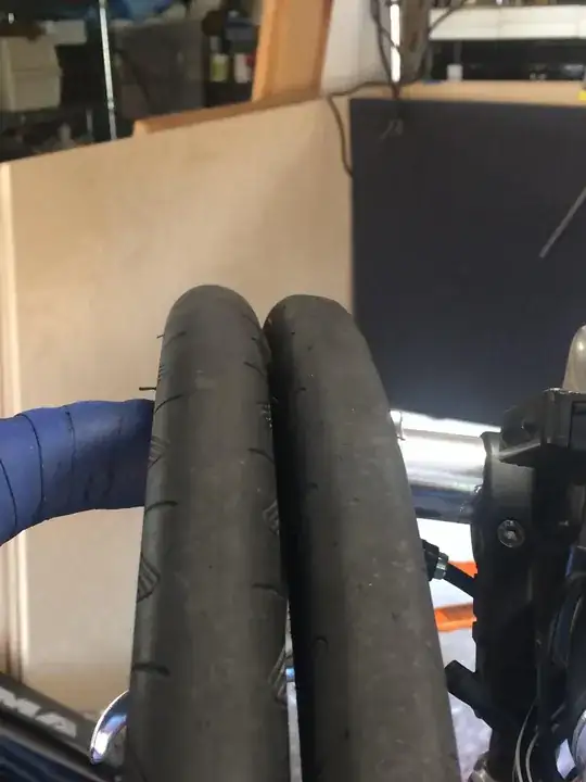 Comparison of tires, one on right showing flat area across tread.