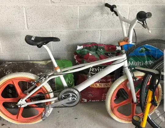 white bmx orange wheels photograph from seller listing