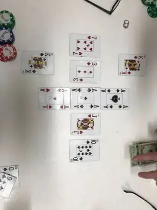 A hand of Tezax Hold 'Em