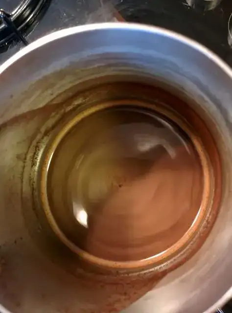 Heating and stirring Turkish coffee for the second time