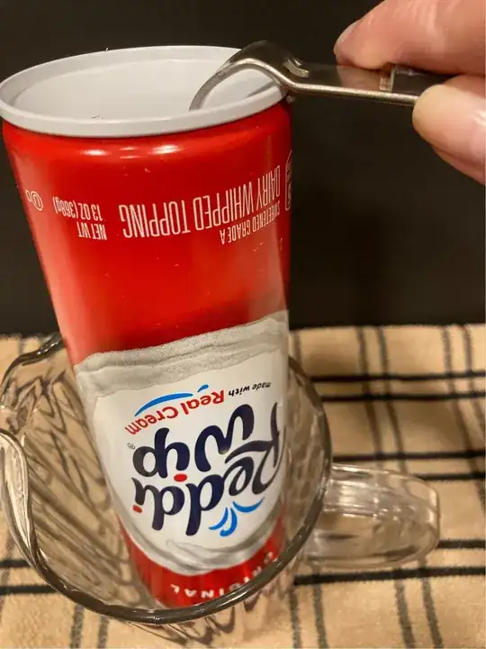 whipped cream canister upside down