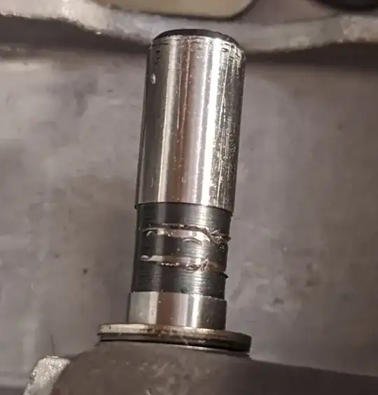 Chewed up bottom shaft from pulley grub screws