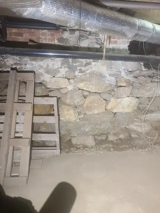 mortar in the top, but this very much looks like a repair. foundation on the right was blown out to connect to an addition
