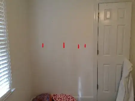 Wall with irregularly spaced studs marked