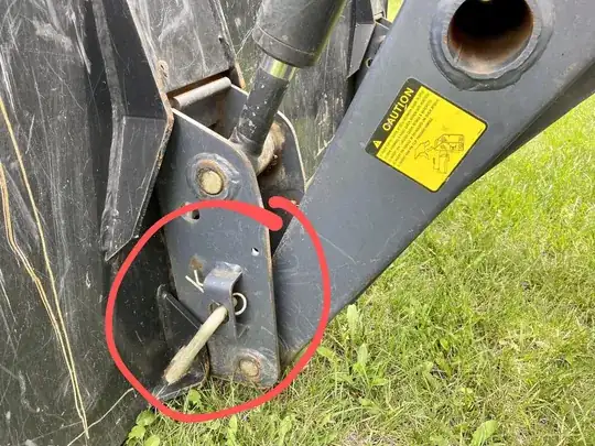 Pin holding bucket on.