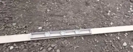 board and bubble level on gravel foundation