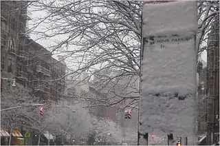 Snow covered vertical signage