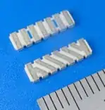 picture of both sides of the AM11DP-ST01* and a ruler from http://www.mmc.co.jp/adv/dev/english/img/contents/antenna/mhz/amd2-01.jpg
