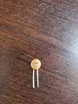 Small capacitor - Not shown