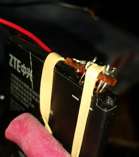 Metal wire in stripboard creates contacts for mobile phone battery