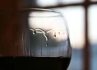 Legs in a glass of red wine