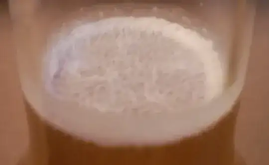 White foam on top of cider