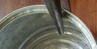 Can with pliers on lip