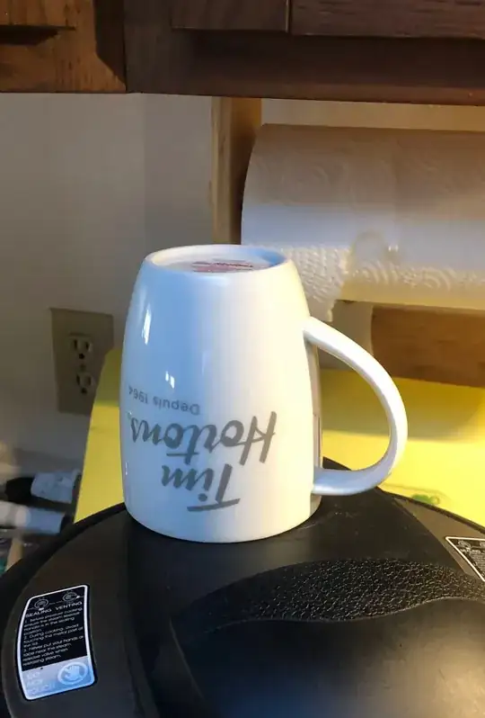 Large mug sitting upside down covering both steam vents.