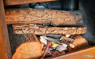 Fire laid with paper lighters under a frame of wood