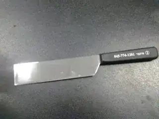 Picture of my chalaf on a table. It's a rectangular shaped knife, with a blade about 6 inches long