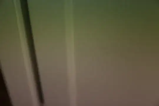 Pink and green lines over a door picture illuminated with white light