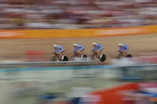 Photo of blurred track cyclists