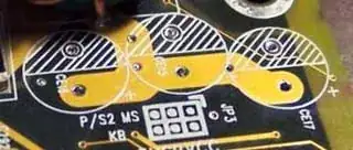 A big circle on the board, with a line through the middle. One side is marked with diagonal lines, and the other has a + sign.