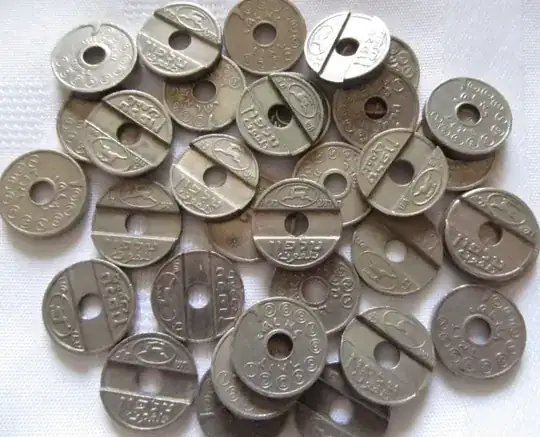 image of asimonim, Israeli phone tokens with a hole in the middle