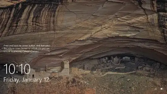 Win10 lock screen image of small stone town built into a rock crevice