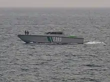 Small grey-and-green boat