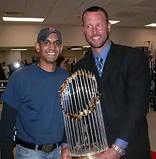 Tim Wakefield (right) with the Commissioner's Trophy