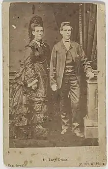 Double image of Evans from 1879 dressed in traditionally male and female clothing