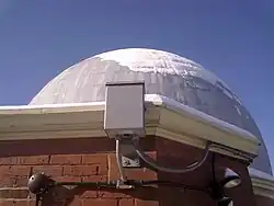 The sky camera mounted near the dome on the roof of the observatory