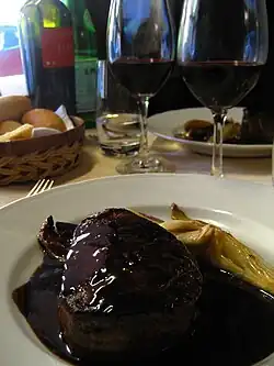 Red meat and a glass of red wine