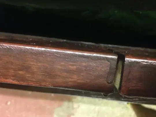 Edge of stained table top